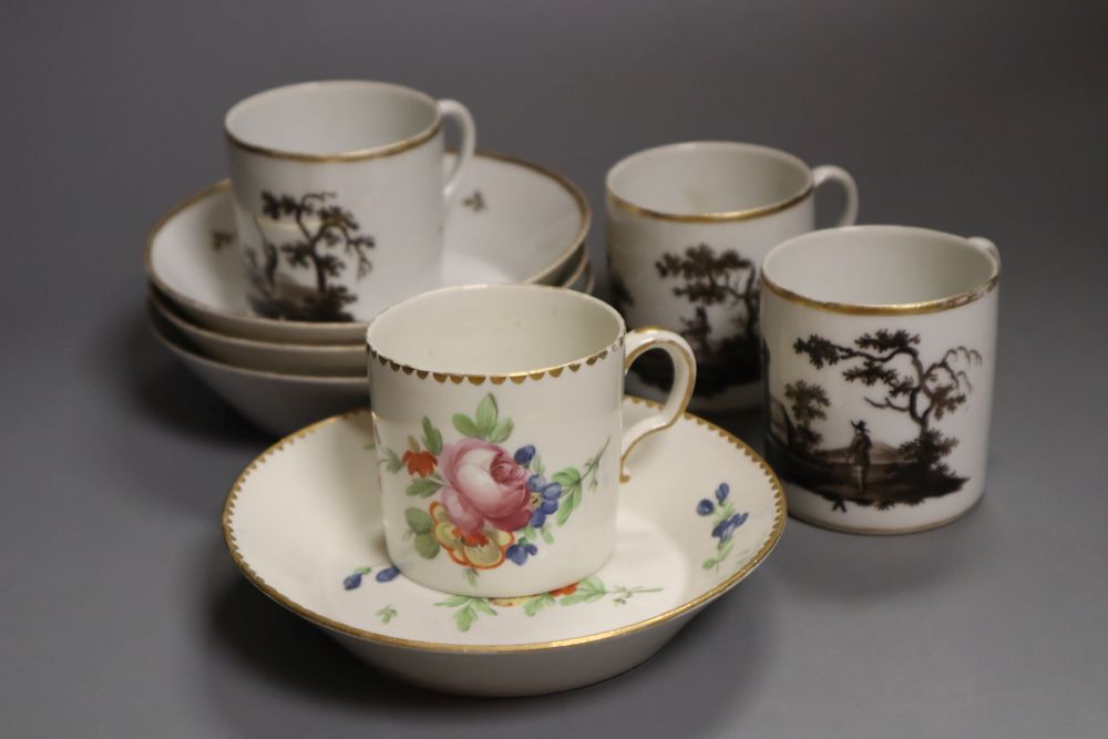 A Frankenthal coffee can and saucer painted with a large rose and other flowers and three Paris porcelain coffee cans and saucer